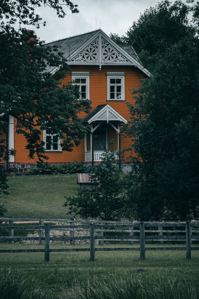 a house with a fence in front of it
